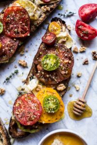 Buttered Brie And Heirloom Tomato Toast With Honey, Thyme And Walnuts